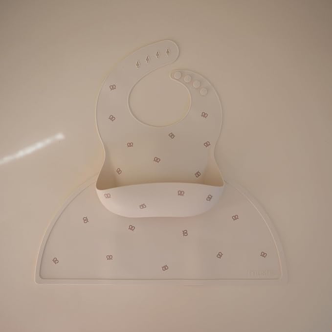 mushie Silicone Baby Bib | Adjustable Fit Waterproof Bibs (Pretzel)