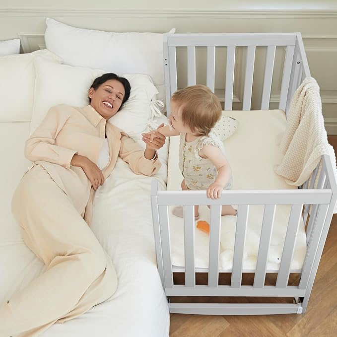 EvoNest Baby Crib, 6 in 1 Convertible Mini Crib with Wheels, 100% New Zealand Solid Wood Growing Bed, 4 Adjustable Mattress Height，White